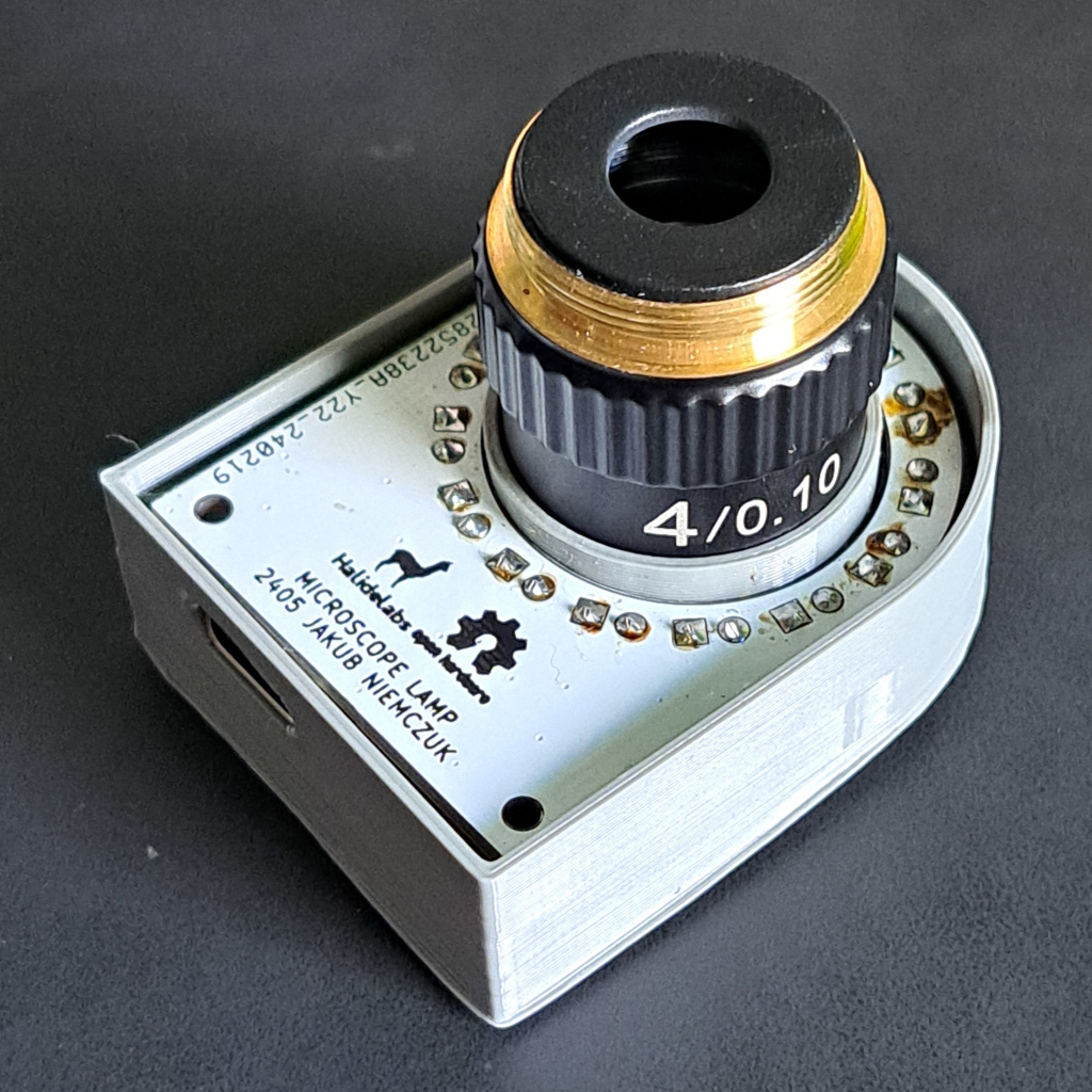 Photograph of the lamp press fitted to a microscope objective (top view)
